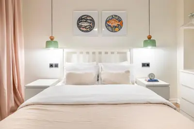 a bedroom with a white bed with white pillows at Stay Beyond the Bosphorus #5 in Istanbul
