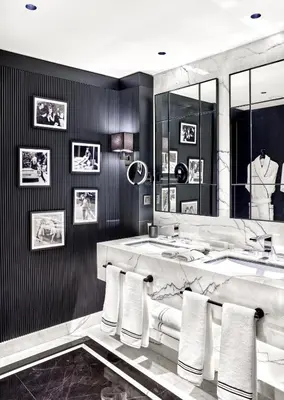 a bathroom with two sinks and a large mirror at Vakko Hotel Sumahan Bosphorus in Istanbul