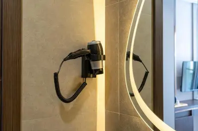 a phone is hanging on a wall in a bathroom at Byon Hotel Şile in Sile