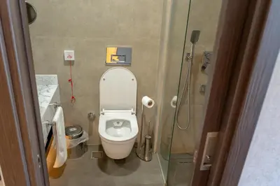 a small bathroom with a toilet and a shower at Byon Hotel Şile in Sile