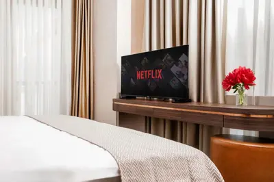 a room with a bed and a tv on a table at Byon Hotel Şile in Sile