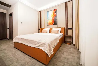 a bedroom with a bed and a painting on the wall at Byon Hotel Şile in Sile