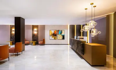 a lobby of a hotel with chairs and a reception desk at Byon Hotel Şile in Sile