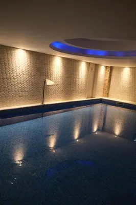 a large swimming pool with a blue ceiling and lights at Ottoman Hotel Sakarya in Sakarya