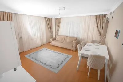 a living room with a couch and a table at New furniture, zero air conditioning, modern and quiet 19 in Istanbul