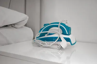a blue and white purse sitting on a bed at New furniture, zero air conditioning, modern and quiet 19 in Istanbul