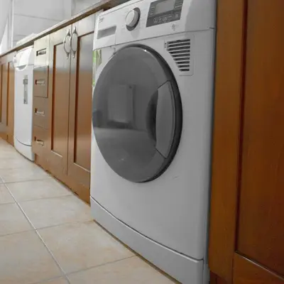 a white washing machine sitting in a laundry room at New furniture, zero air conditioning, modern and quiet 19 in Istanbul