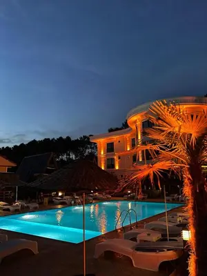 a large swimming pool in front of a building at Kerpe Bungalov Hotel in Kandıra