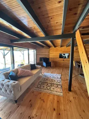 a living room with a couch and a table at Uysal Dağevleri in Bilecik