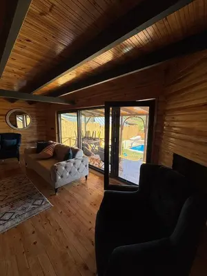 a living room with a couch and a fireplace at Uysal Dağevleri in Bilecik