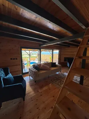 a living room with a couch and a ladder at Uysal Dağevleri in Bilecik