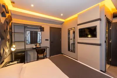 a hotel room with a bed and a desk at White Palace Hotel in Istanbul