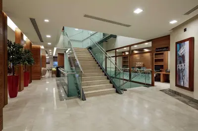 a lobby with a staircase in a building at Hilton Garden Inn Corlu in Corlu