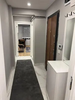 a hallway with a kitchen and a dining room at AYD Apart Elmadağ Taksim in Istanbul