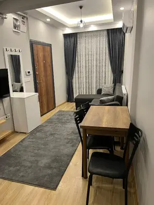 a living room with a table and a dining room at AYD Apart Elmadağ Taksim in Istanbul