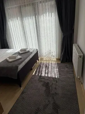 a bedroom with a bed and a large window at AYD Apart Elmadağ Taksim in Istanbul