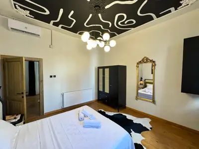 a bedroom with a bed and a mirror on the ceiling at Mansion Istanbulite in Istanbul