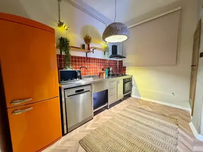 a small kitchen with a sink and a stove at Mansion Istanbulite in Istanbul