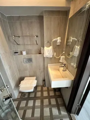 a bathroom with a sink and a toilet at Nacre Boutique Residence in Istanbul