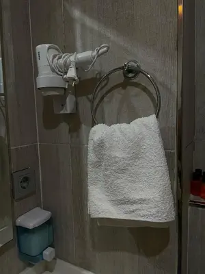 a towel hanging on a towel rack in a bathroom at Nacre Boutique Residence in Istanbul