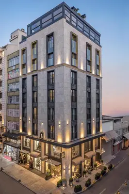 an exterior view of a building with lights at Lunet Old City Hotel in Istanbul