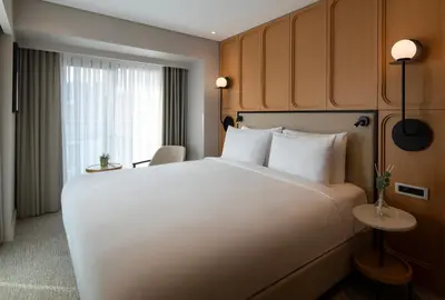 a bedroom with a large white bed and a window at Lunet Old City Hotel in Istanbul
