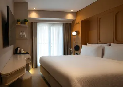 a hotel room with a large bed and a window at Lunet Old City Hotel in Istanbul