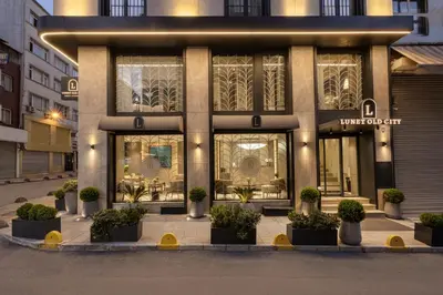 a building with potted plants in front of it at Lunet Old City Hotel in Istanbul