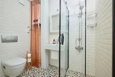 a bathroom with a shower and a toilet and a sink at Stunning Apartment at Unbeatable Location in Istanbul