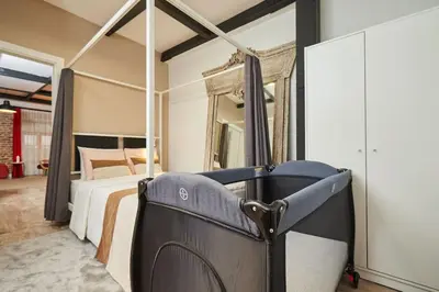 a bedroom with a bed and a mirror at Stunning 2BR 1 Min Metro&Galata in Istanbul