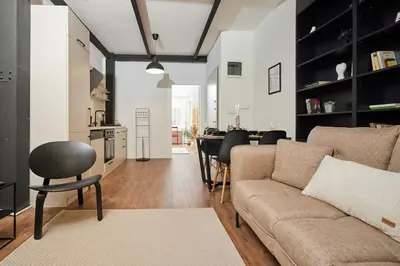 a living room with a couch and a table at Stunning 2BR 1 Min Metro&Galata in Istanbul