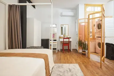 a bedroom with a bed and a desk with a table at Stylish 2BR Apt Galata-Taksim Area Near Metro in Istanbul
