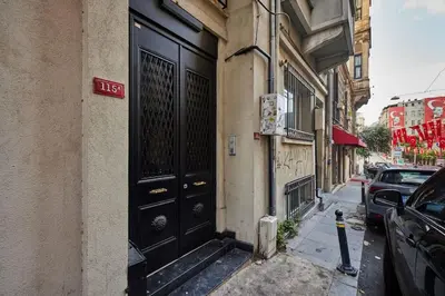 a black door on the side of a building at Stylish 2BR Apt Galata-Taksim Area Near Metro in Istanbul