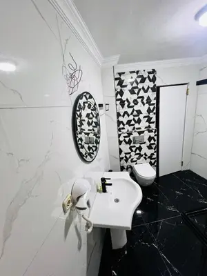 a bathroom with a white sink and a toilet at Pembe Köşk Old City Center in Istanbul