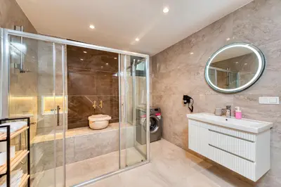 a bathroom with a shower and a sink and a toilet at Port Apart Hotel in Istanbul