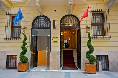 a building with two flags in front of it at Taxim Lounge Hotel Special Category in Istanbul