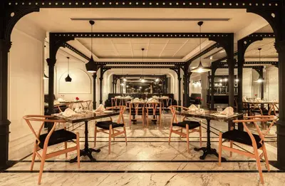a dining room with a table and chairs at Metropolitan Hotels Taksim in Istanbul