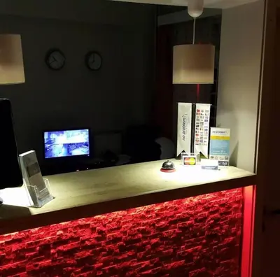 a counter in a room with a television and a red counter top at NO PROBLEM OTEL Pansiyon in Tekirdag