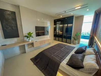 a bedroom with a large bed and a flat screen tv at Beykoz Breeze in Beykoz
