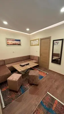 a living room with a couch and a table at Albatros suite in Istanbul