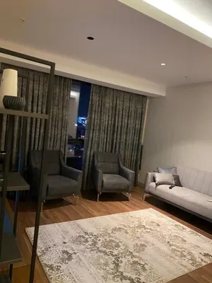 a living room with a couch and two chairs at Low Price Luxury Apartment Perfect for An Amazing stay In ISTANBUL in Istanbul