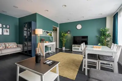 a living room with a couch and a table at sevim suites Nişantaşı Center in Istanbul