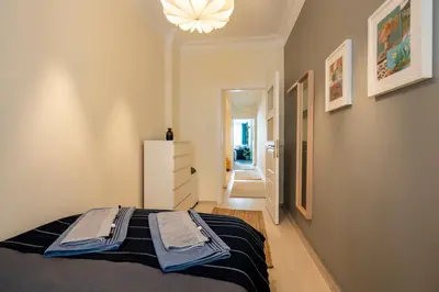 a bedroom with a bed with towels on it at sevim suites Nişantaşı Center in Istanbul