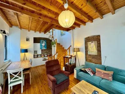 a living room with a blue couch and a table at The Wooden 17 in Istanbul