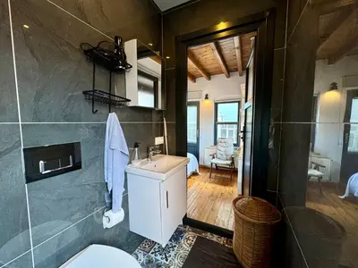 a bathroom with a sink and a toilet in a room at The Wooden 17 in Istanbul