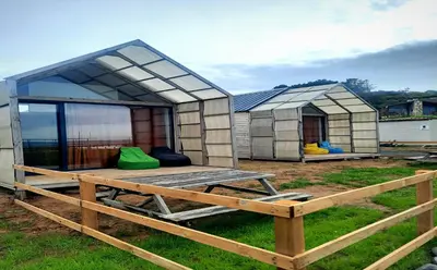 a small house with a roof on a yard at Kackar Kamp istanbul in Domalı