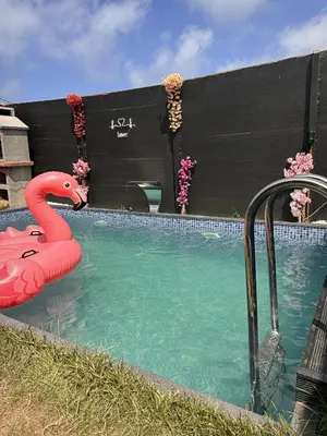 a swimming pool with a flamingo float in the water at Kackar Kamp istanbul in Domalı