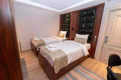 a room with two beds and a wine cellar at THE MUA LUXURY HOMEs in Istanbul