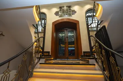 a set of stairs leading to a wooden door at THE MUA LUXURY HOMEs in Istanbul