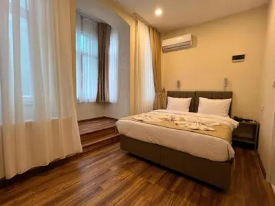 a bedroom with a bed and a large window at Nacre 360 in Istanbul